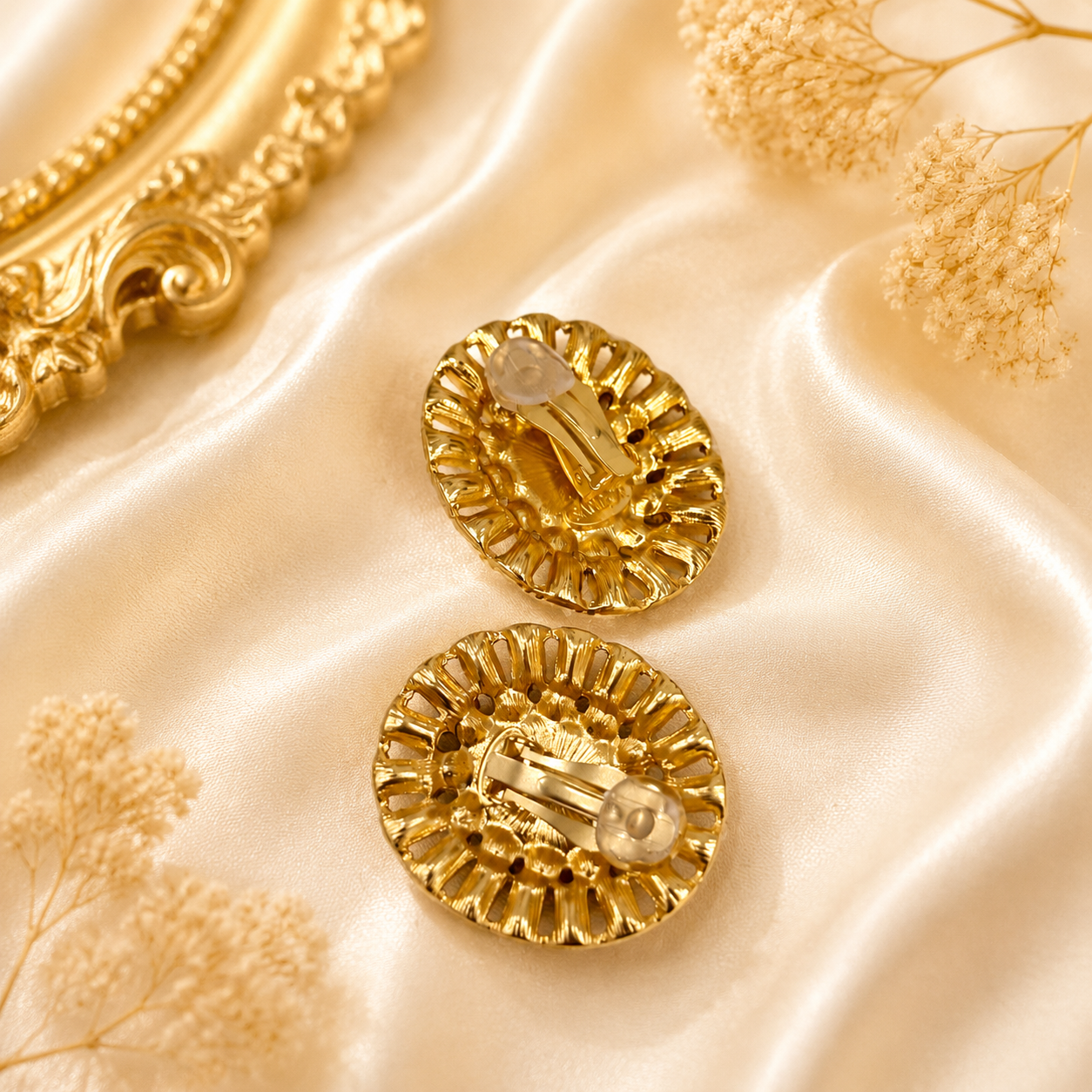 Back view of gold-tone round earrings showing stud and clip-on hardware
