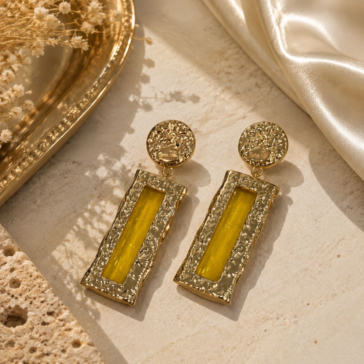 Gold-tone amber glass-style rectangular drop stud earrings close-up