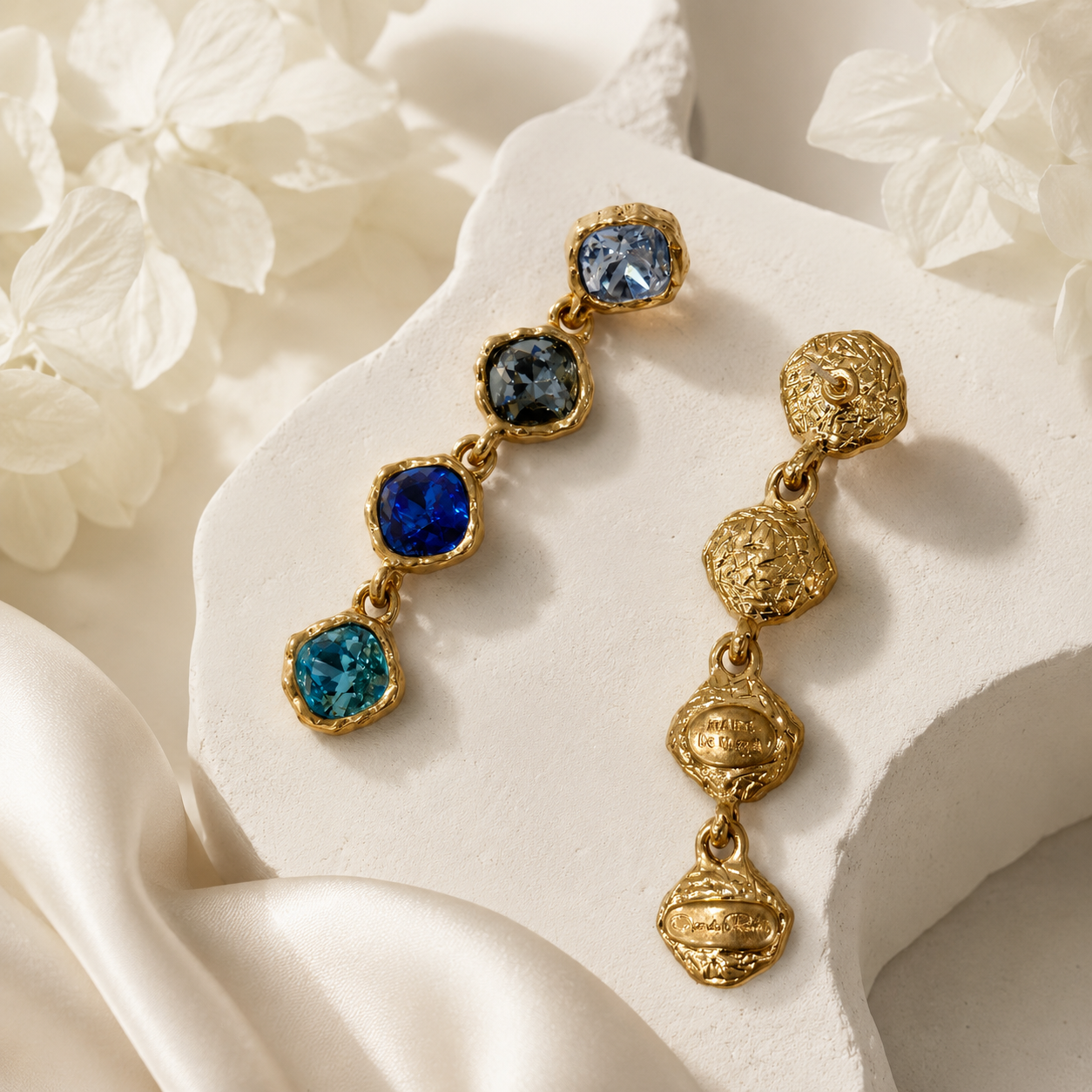 Front and back view of blue gold-tone crystal-style drop stud earrings