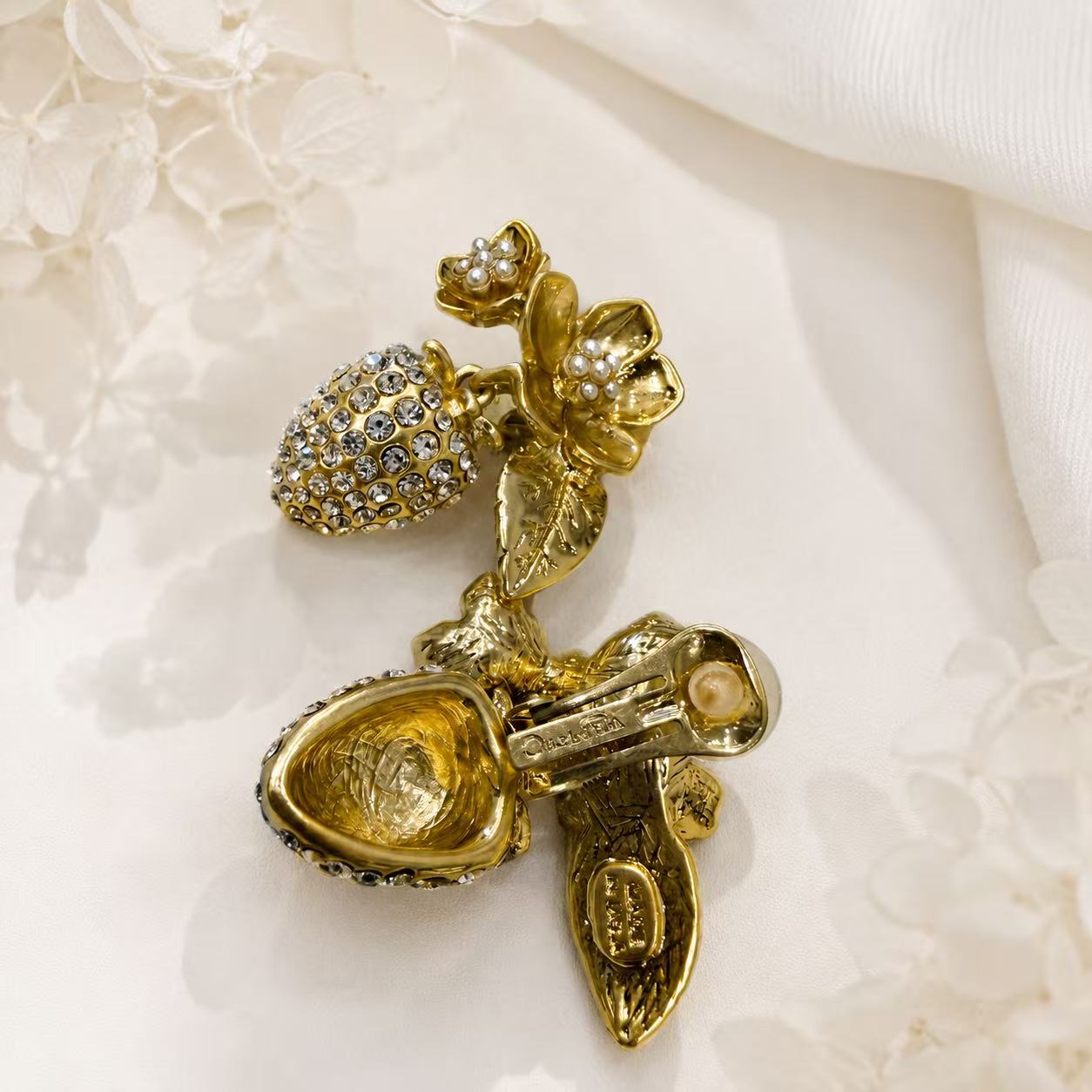 Gold-tone floral pearl-style drop clip-on earrings back detail