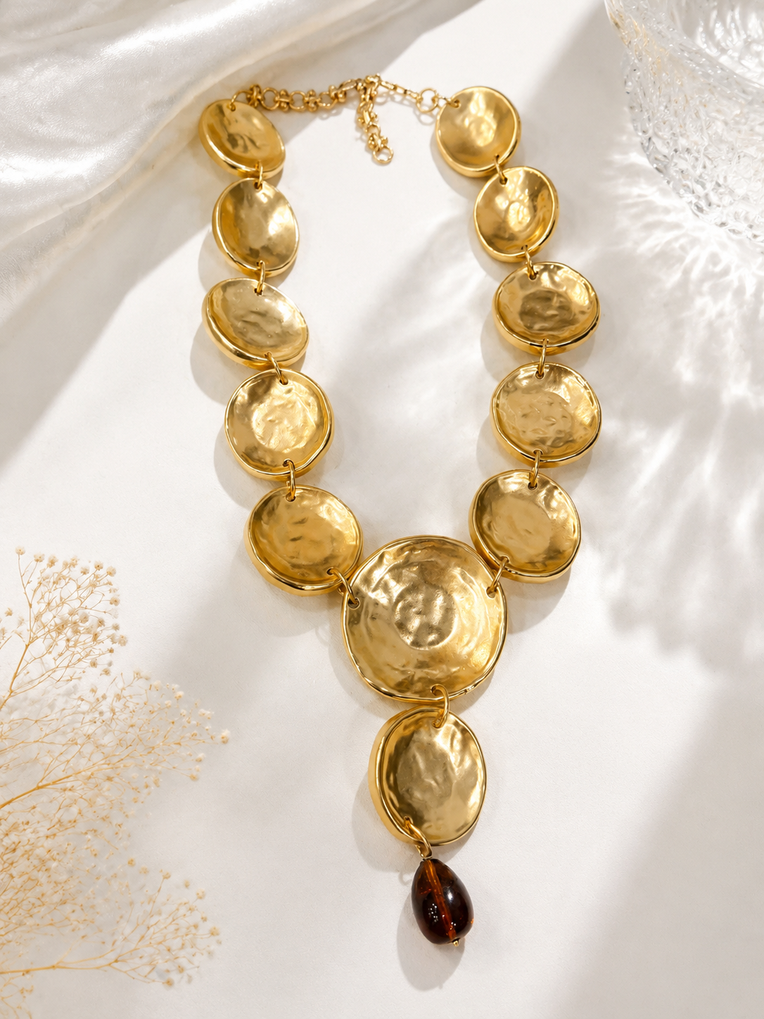 Back view of gold-tone statement necklace with adjustable extender chain