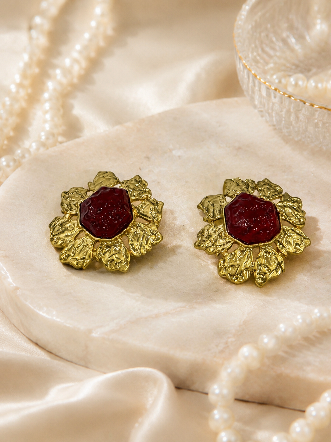 Gold-tone red glass sunflower clip-on earrings detail view