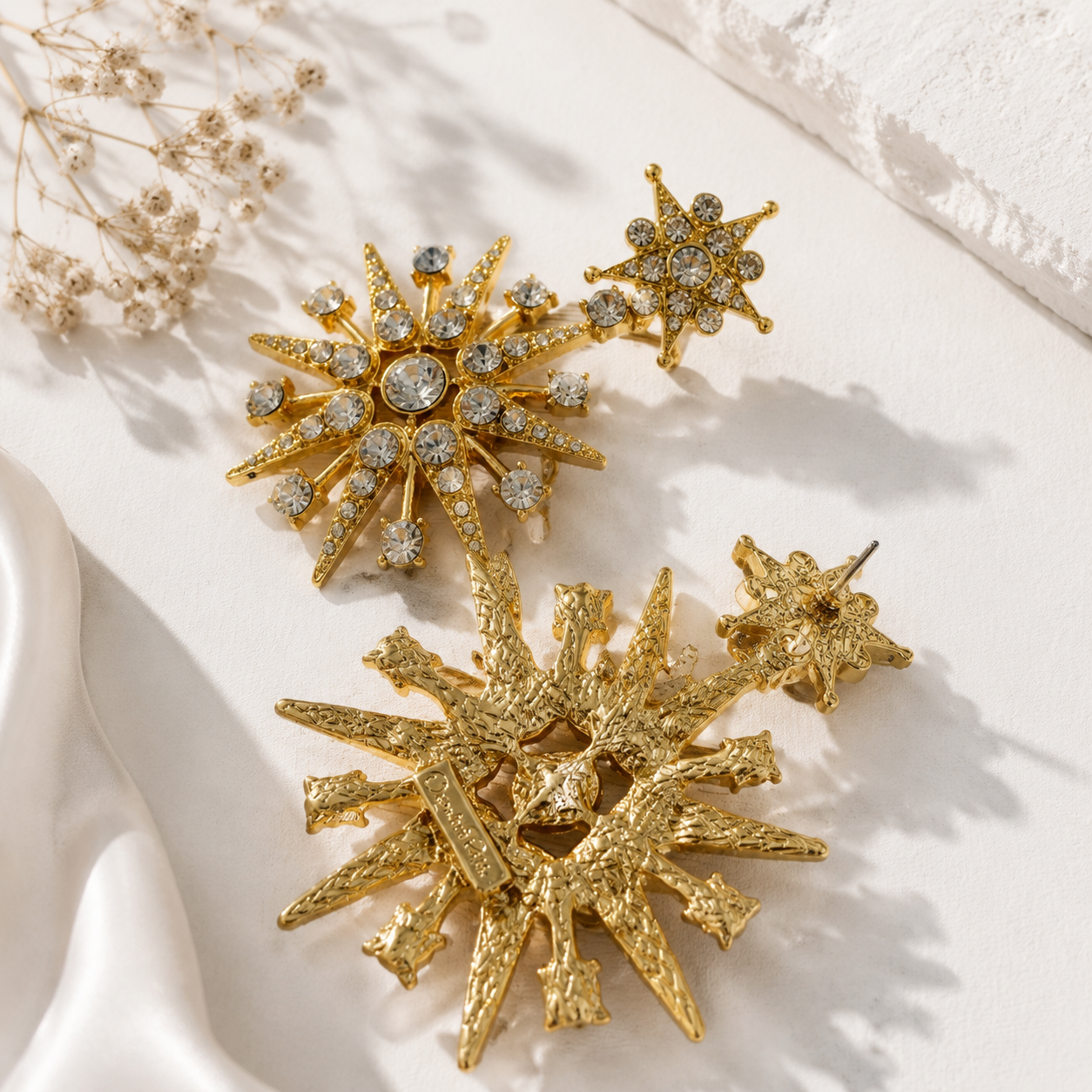 Gold-tone starburst crystal-style-style stud earrings back and post detail