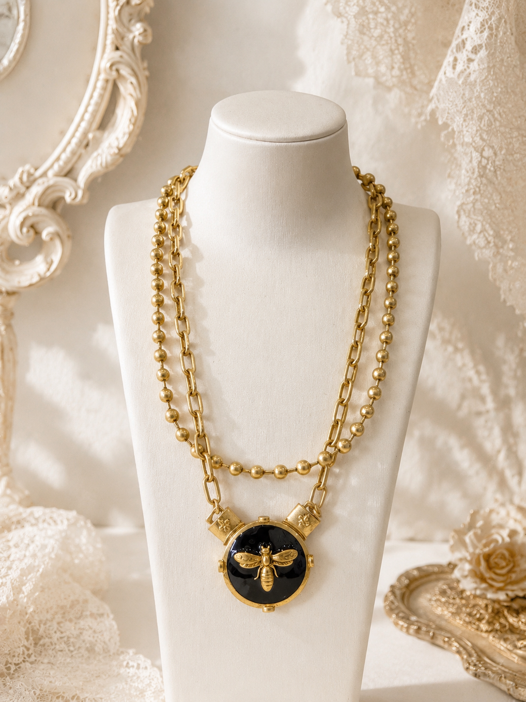 Vintage-inspired double-layer bee necklace displayed on a jewelry bust