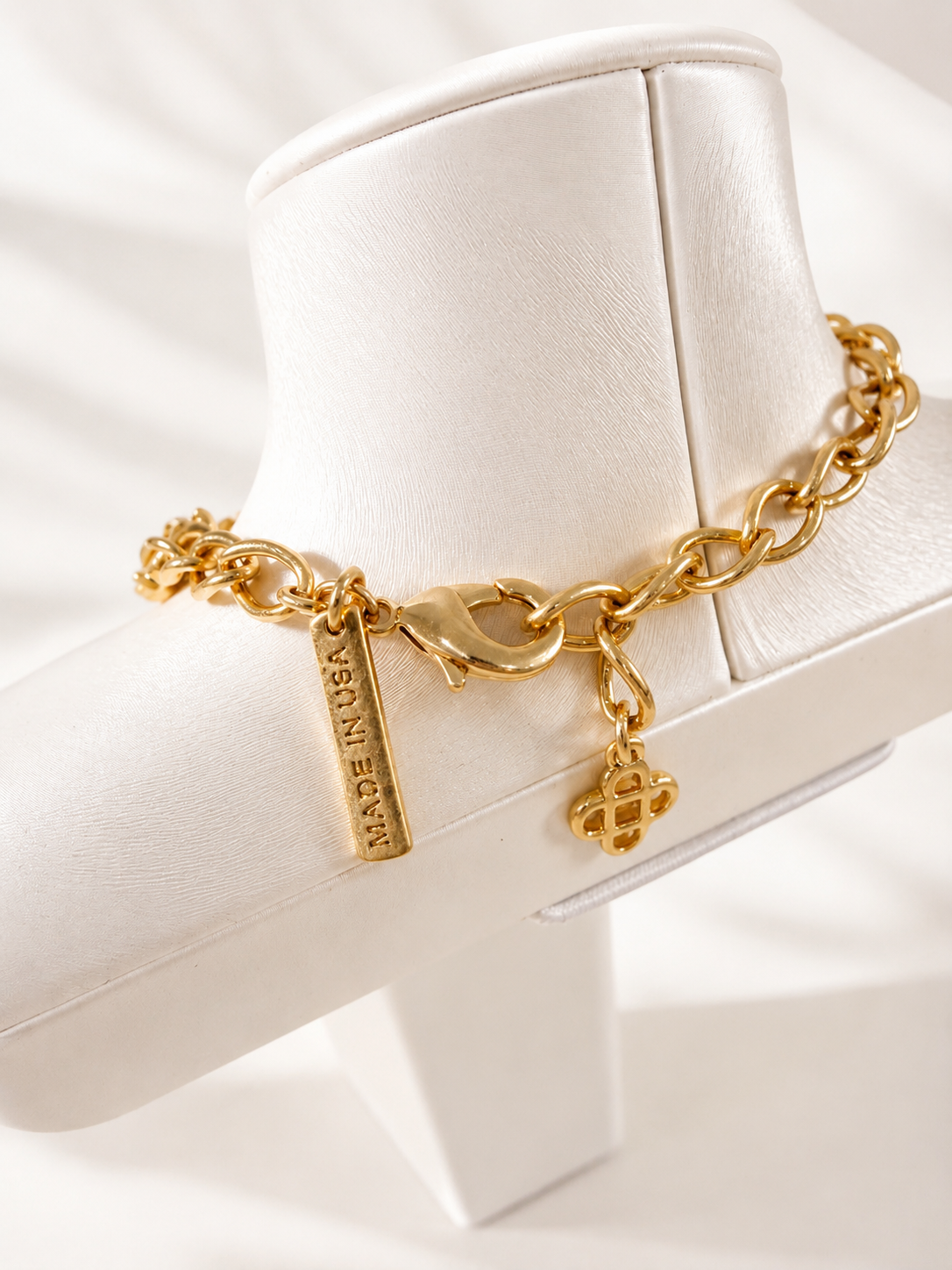 Gold-tone jewelry set clasp and chain detail