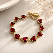 Gold-tone red crystal-style heart bracelet from matching necklace set
