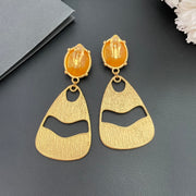 Back view of 18K gold-plated textured openwork drop clip-on earrings