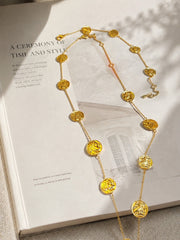 18K gold-tone double-sided coin necklace set flat lay