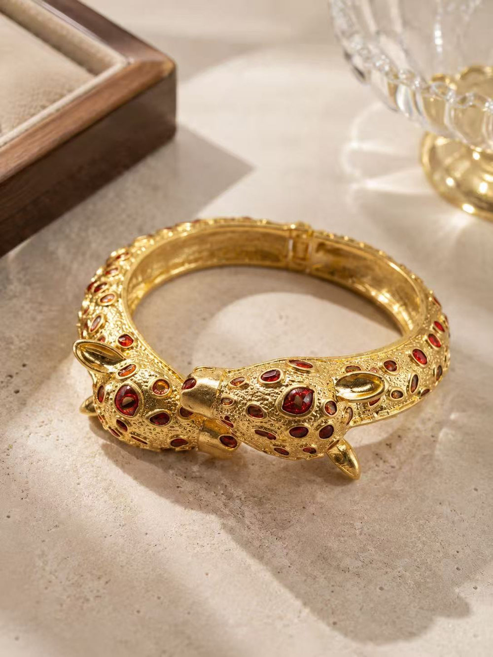 Gold-tone red stone-style leopard head open cuff bracelet front view