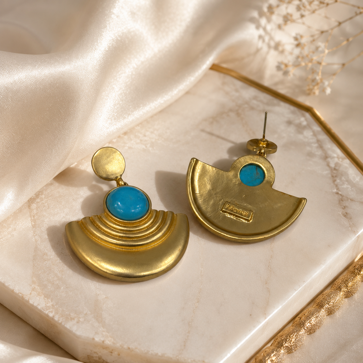 Front and back view of gold-tone fan-shaped turquoise-style stud earrings