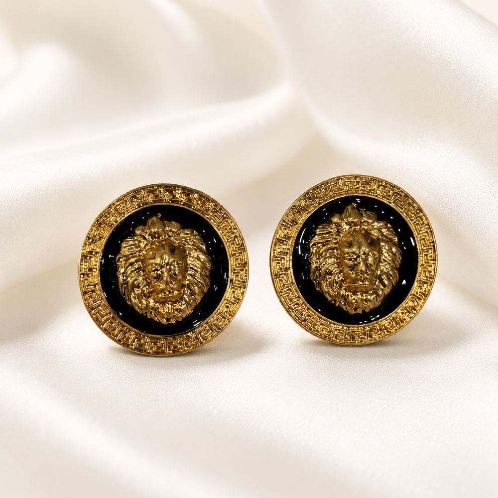 Pair of gold-tone lion enamel-style stud earrings with black circular centers