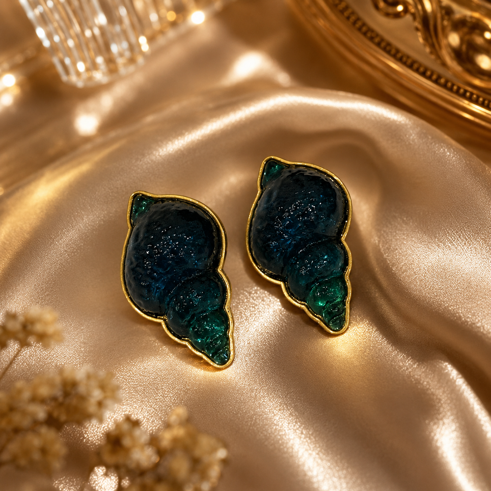 Pair of gold-tone teal conch shell-shaped stud earrings