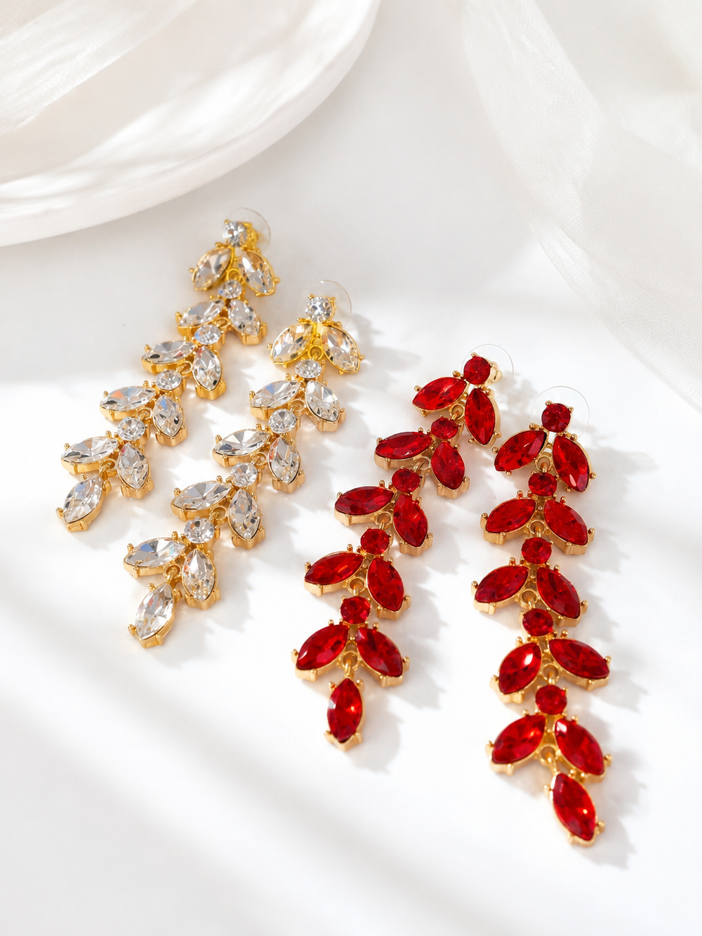 Gold-tone leaf rhinestone drop stud earrings in red and clear