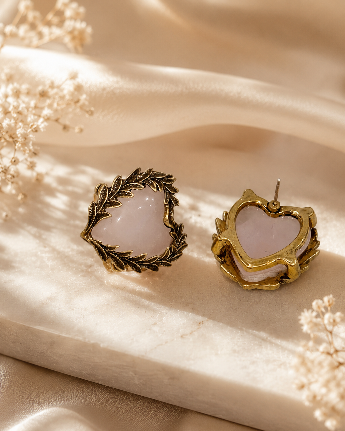 Pink crystal-style heart stud earrings shown from front and back