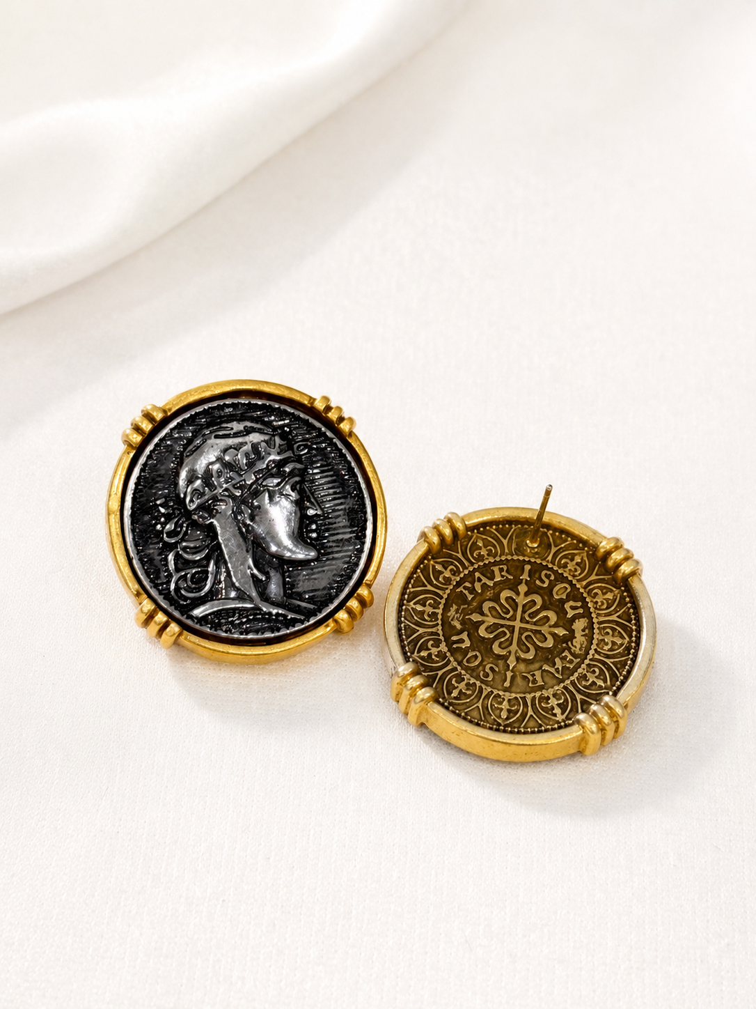 Front and back view of a gold-tone coin-inspired portrait stud earring with ornate reverse pattern