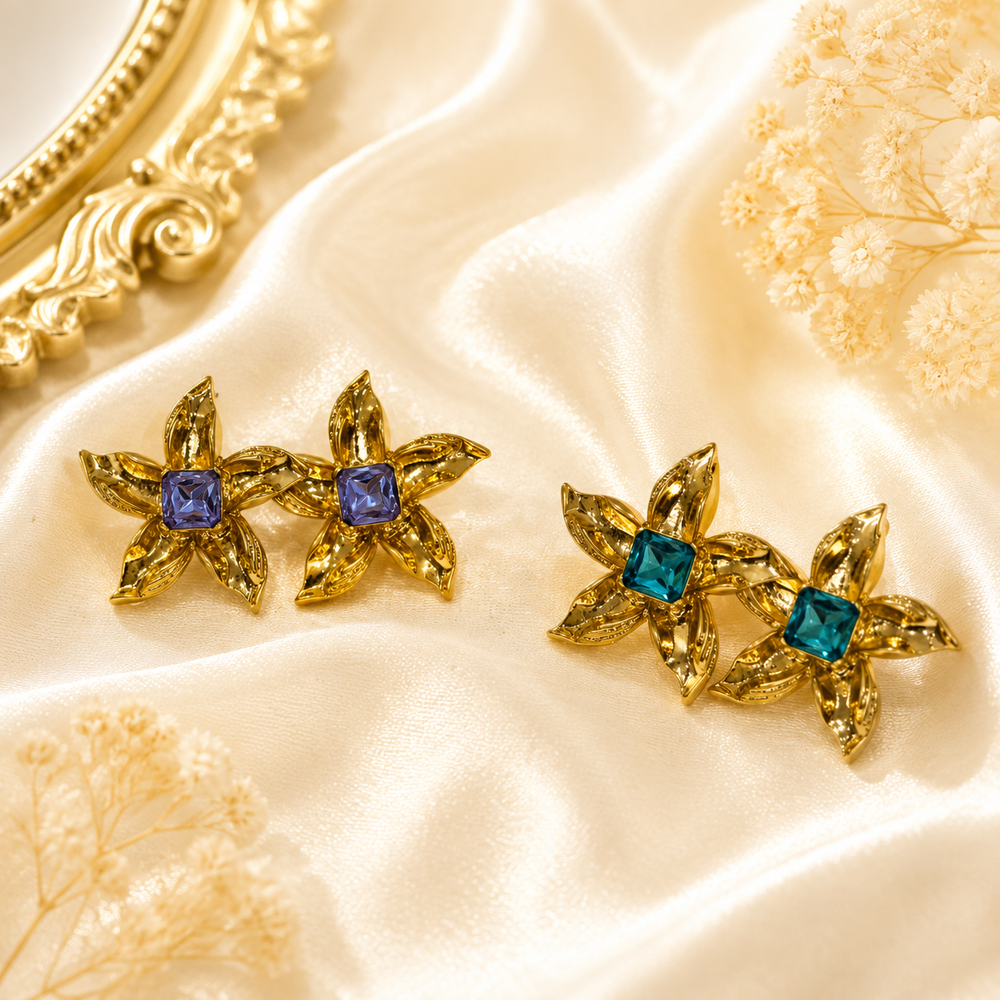 Gold-tone floral stud earrings with Tiffany Blue and purple square crystal-style centers