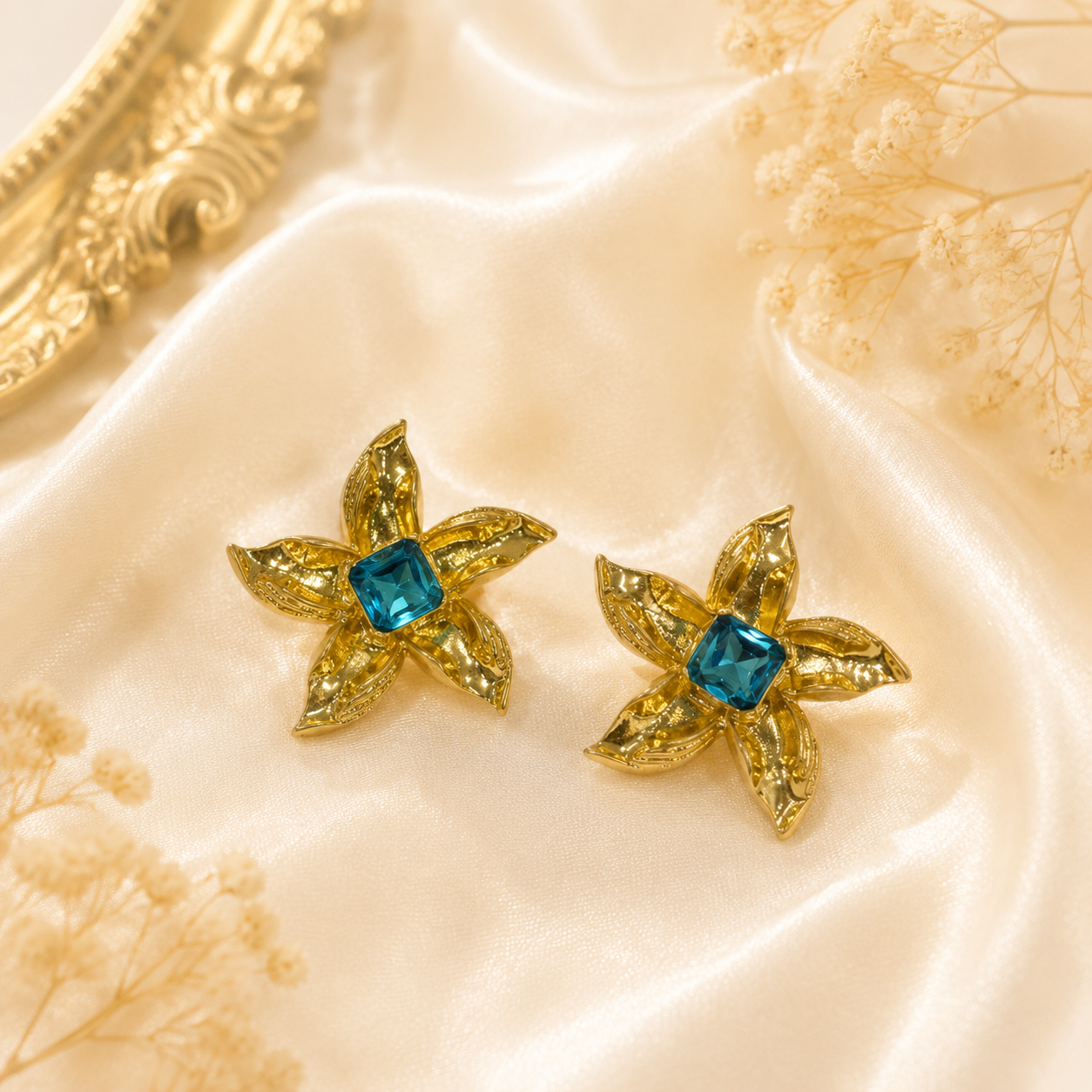 Tiffany Blue gold-tone floral stud earrings with square crystal-style centers