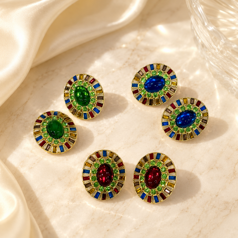 Gold-tone round earrings with red, blue, and green multicolor glass details