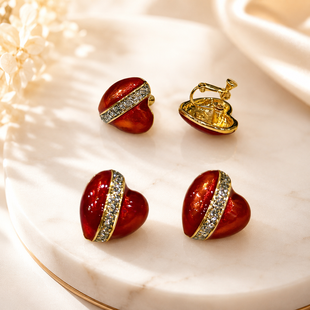 Red enamel heart earrings in stud and clip-on styles with gold-tone trim