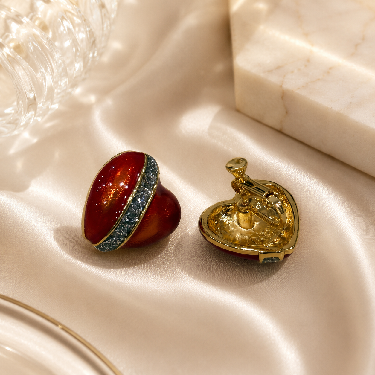 Red enamel heart clip-on earrings with gold-tone clasp detail