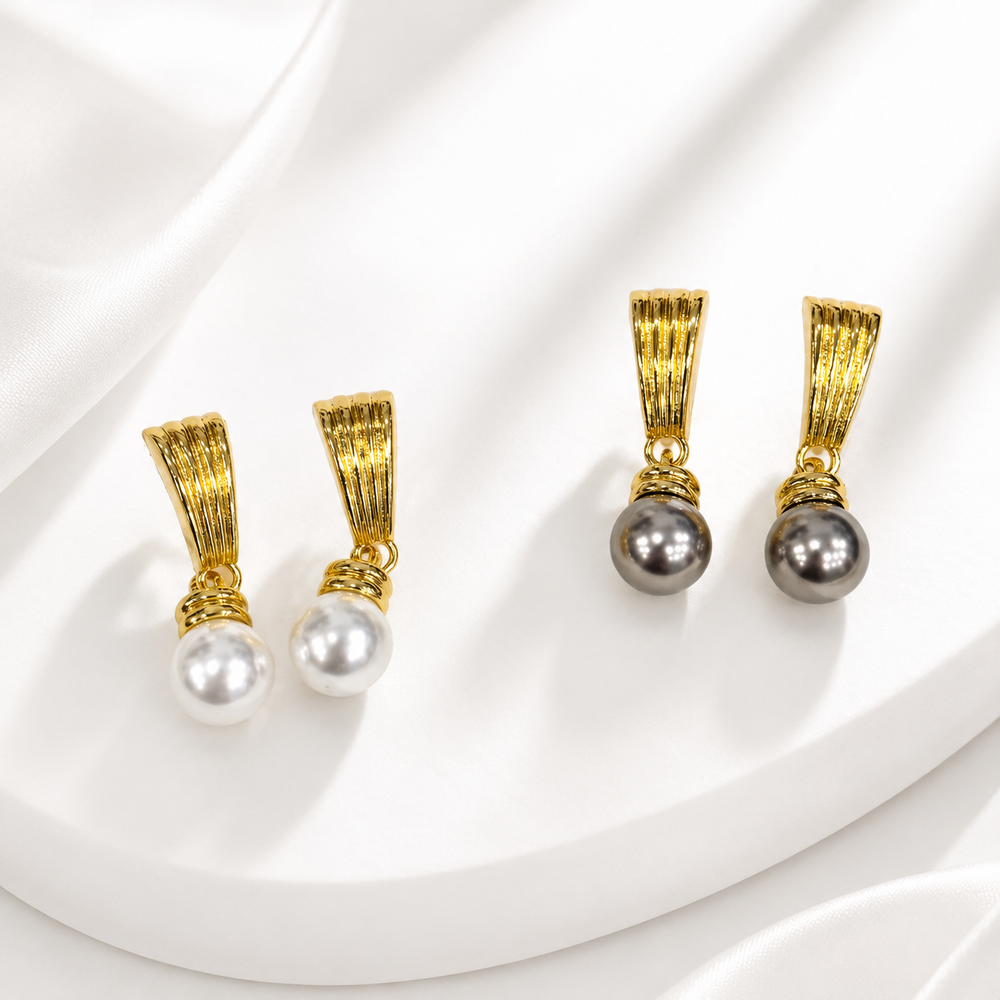 Pearl drop stud earrings in gray and white with a gold-tone finish.