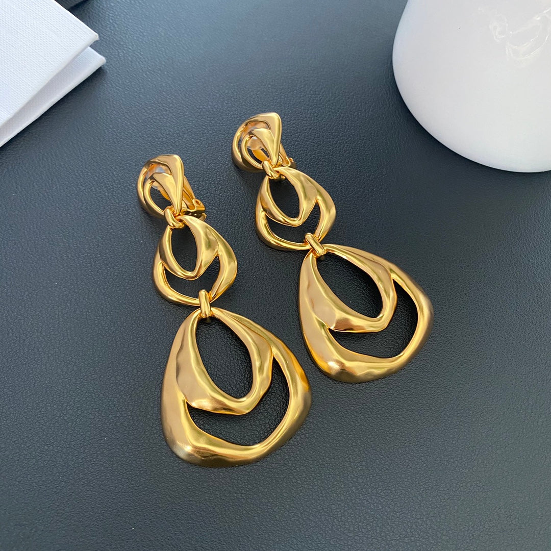 Front view of 24K gold-tone organic drop clip-on earrings