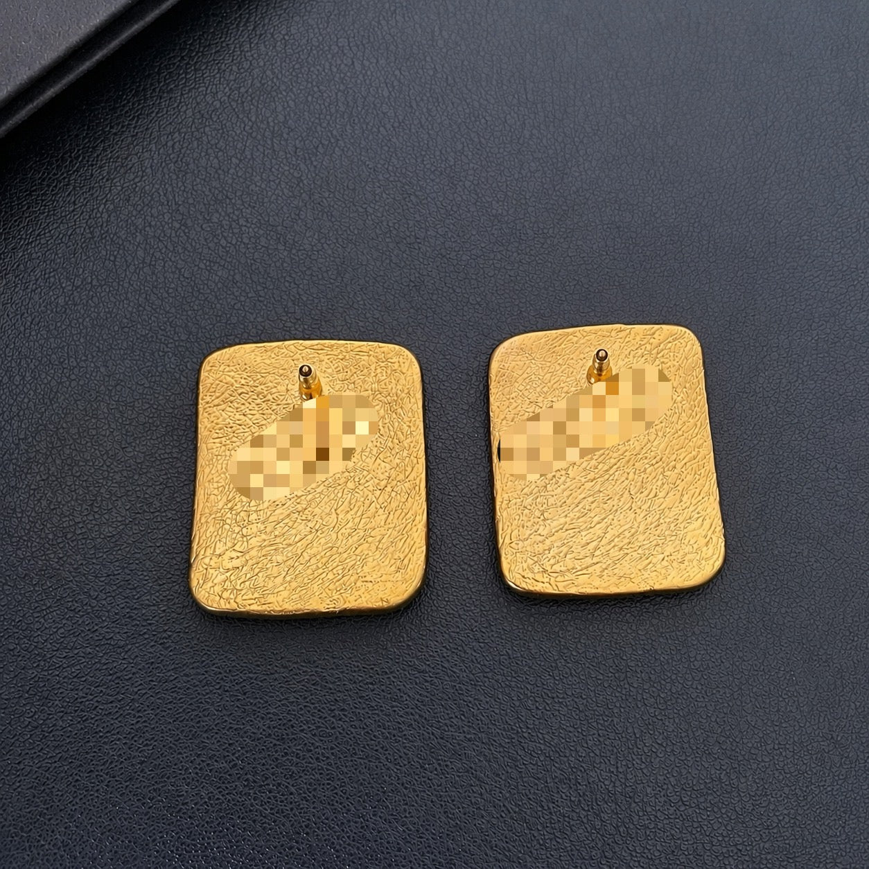 Back view of the stud closure on square letter earrings