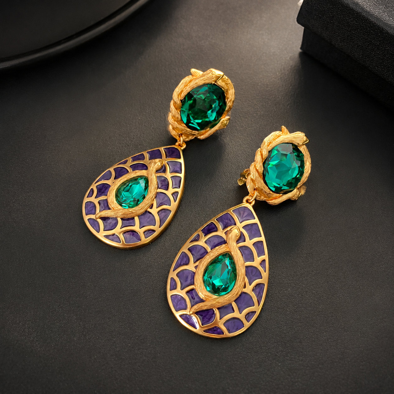 Green colorway dangle clip-on earrings with textured gold-tone frame, detail view