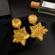 24K gold-tone vintage-inspired five-point star clip-on earrings, front view