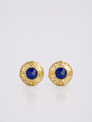 Textured gold-tone clip-on statement earrings with deep blue centers front view