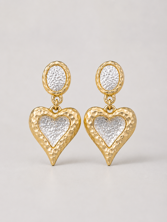 Gold-tone heart clip-on drop earrings with silver-tone centers front view