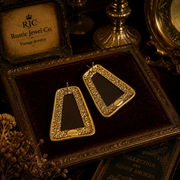Back detail of gold-tone red stone-style stud earrings with post backs