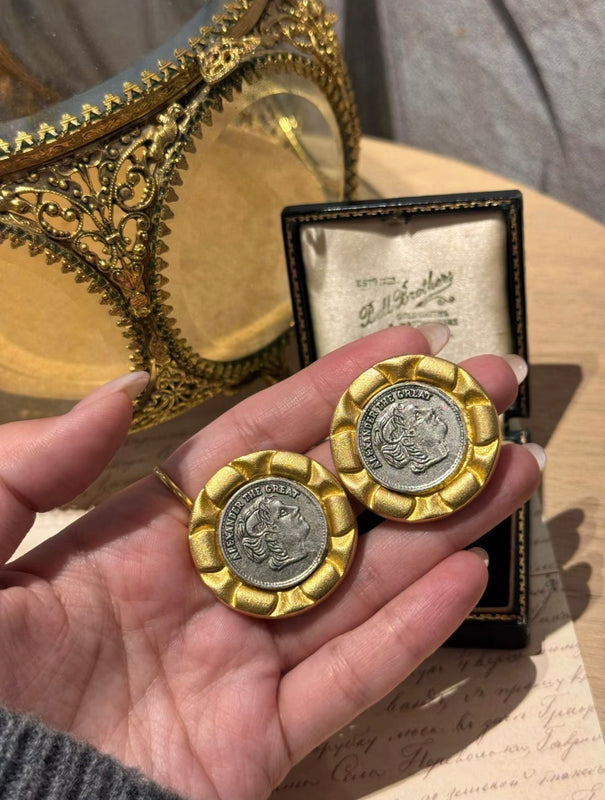 Gold-tone round clip-on statement earrings with portrait medallion detail