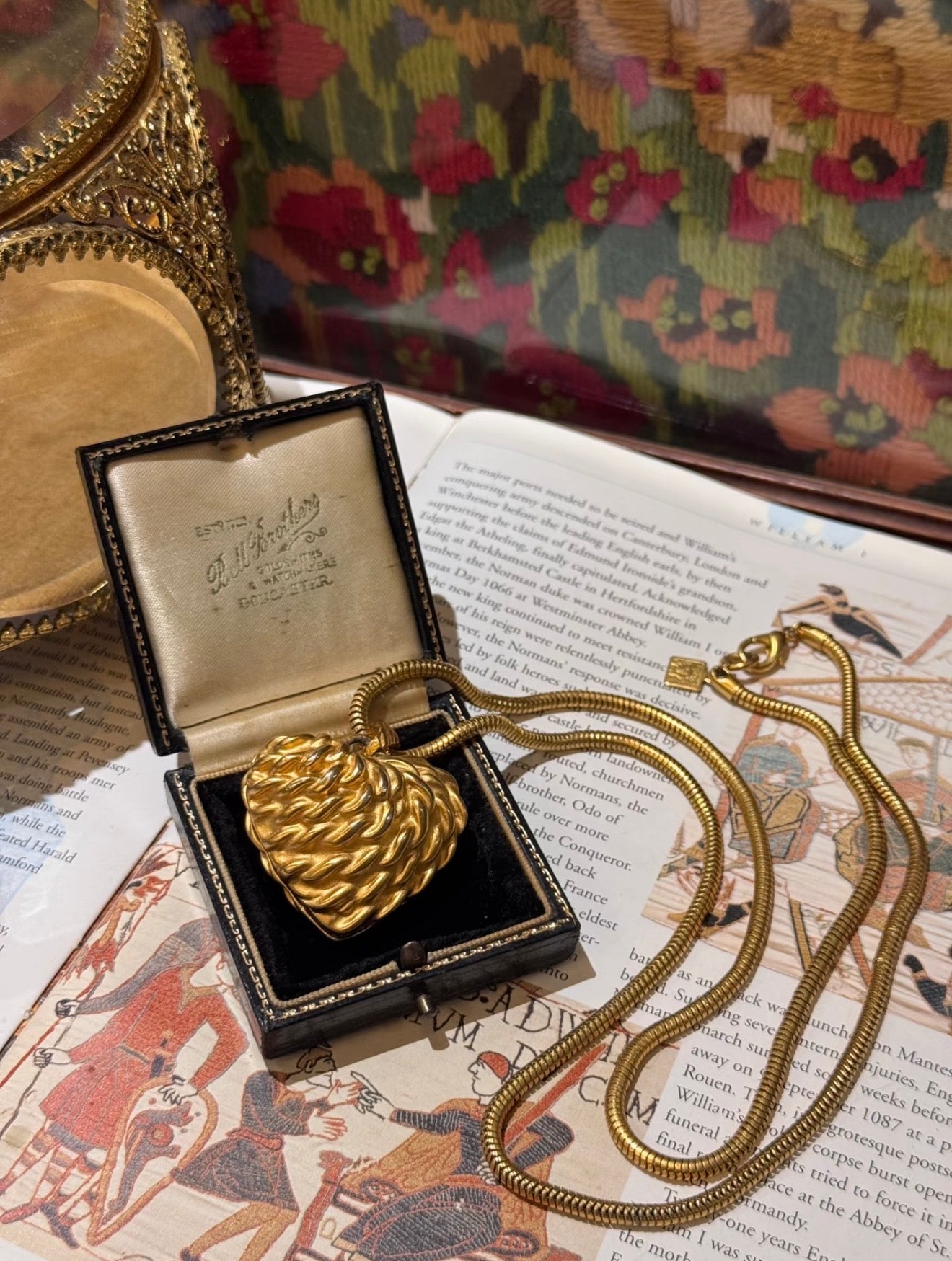 Gold-tone heart pendant necklace with sculptural ridged texture