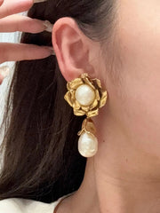 18K gold-plated floral pearl-style drop clip-on earring shown worn on the ear