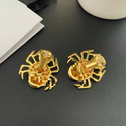 Reverse view of the spider earrings showing the clip-on fastenings