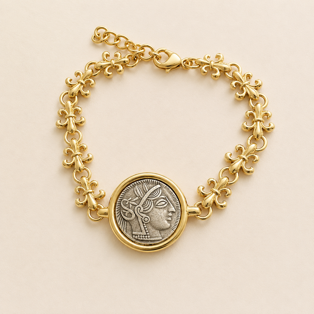 Front view of a vintage-inspired double-sided coin link bracelet