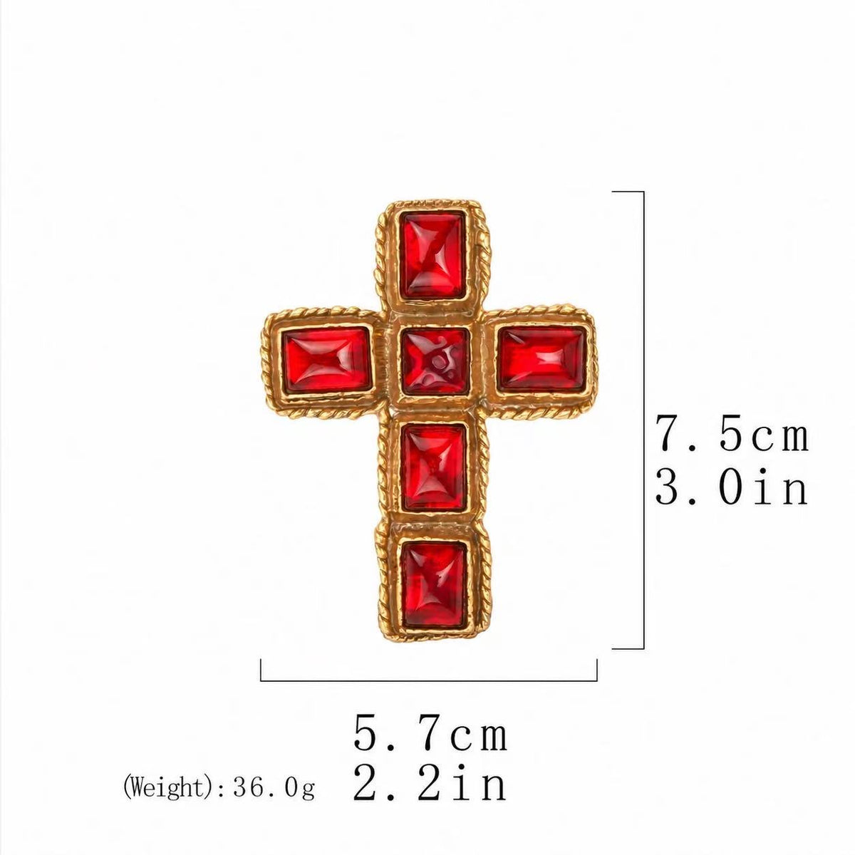 Cross-shaped brooch with red faceted accents and twisted gold-tone edging on a white background