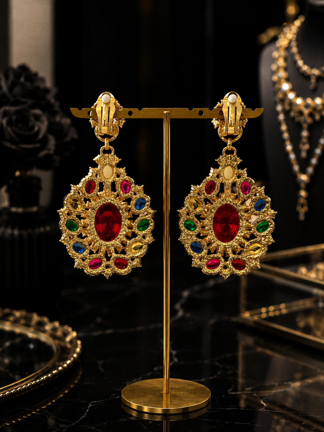 Back view of multicolor glass teardrop earrings showing clip-on closures