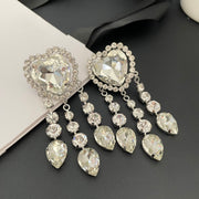 Pair of silver-tone crystal heart clip-on earrings with three teardrop tassels on each earring