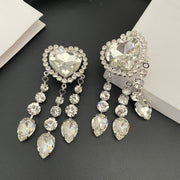 Front view of the heart-shaped crystal tops and dangling teardrop crystal tassels