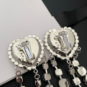Reverse view of the heart-shaped earrings showing the clip-on fastenings