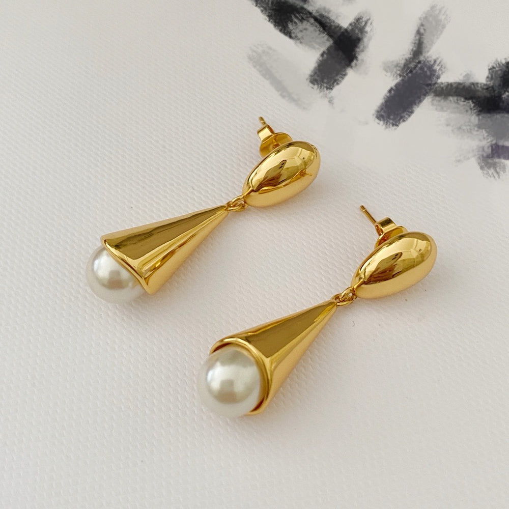 Front view of 18K gold-plated pearl-style drop stud earrings with sculptural cone pendants