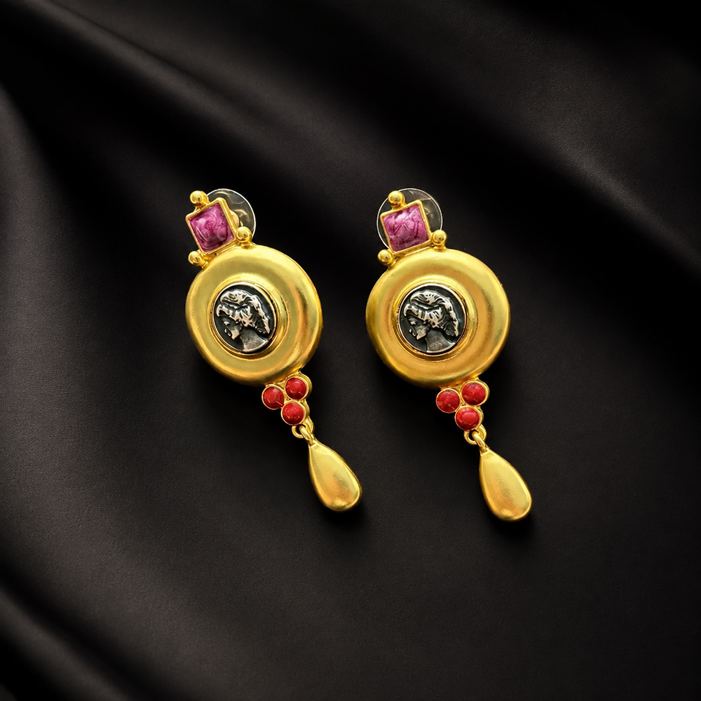 Front view of gold-tone Apollo relief statement earrings with magenta and red accents
