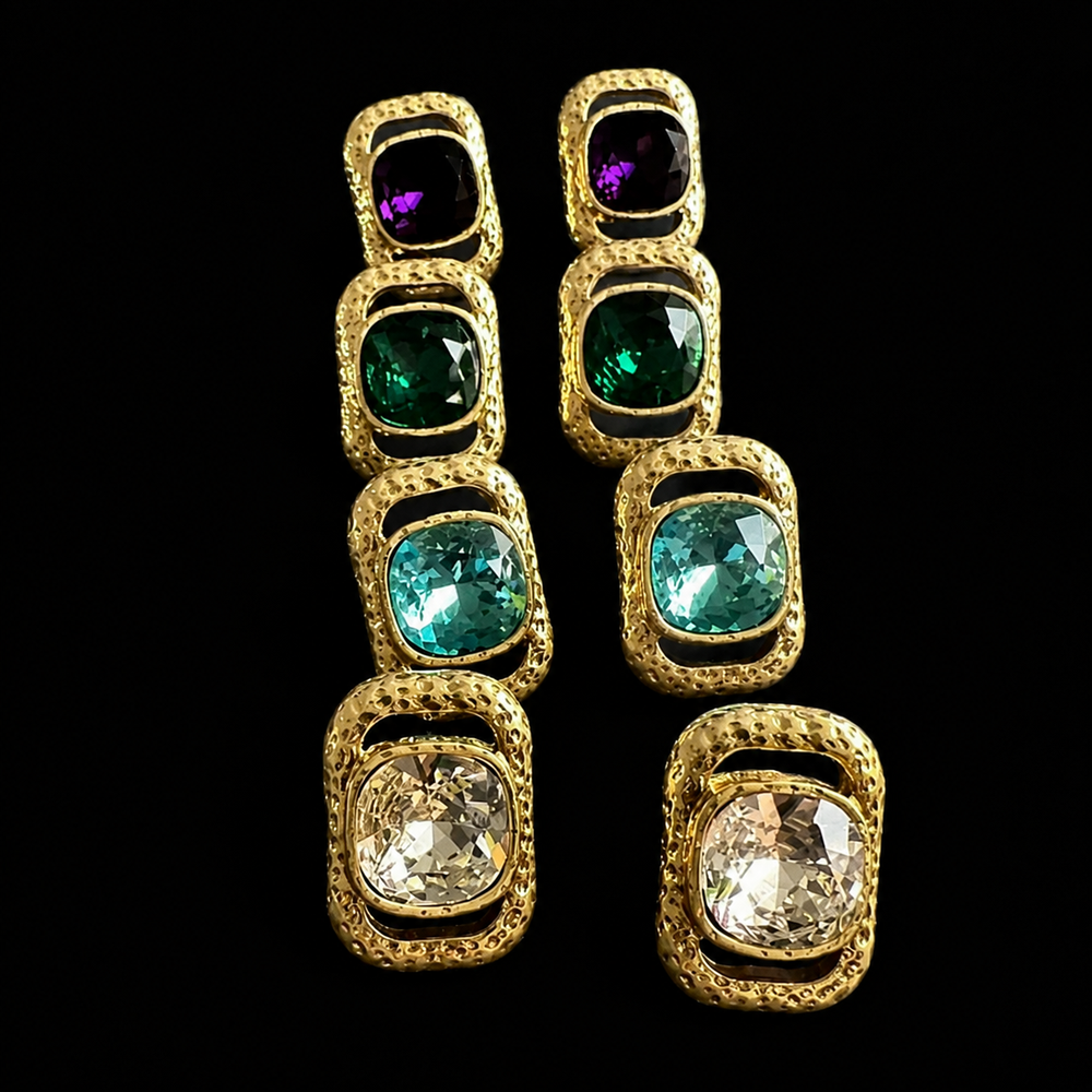 Group view of cushion-shape faceted stud earrings in purple, green, turquoise blue, and clear
