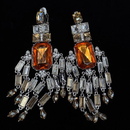 Amber-tone geometric clip-on earrings with rectangular accents and dangling details