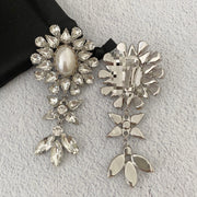 Front and reverse view showing the floral earring design and clip-on fastening