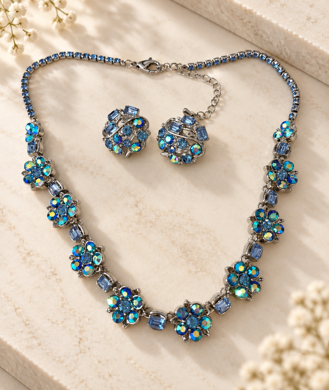 Style B blue floral necklace and matching stud earrings with iridescent faceted stones