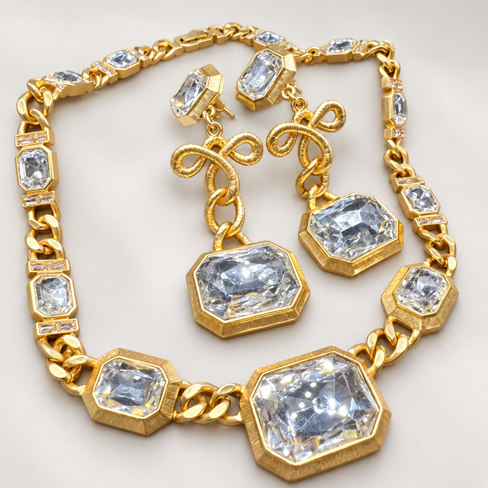 Gold-tone geometric faceted stone necklace with matching bow-detail drop clip-on earrings