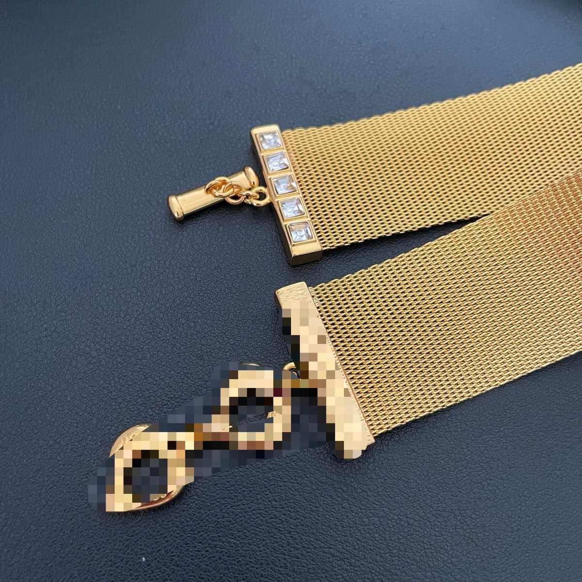 Detail of the choker mesh band, stone-set end bar and toggle closure